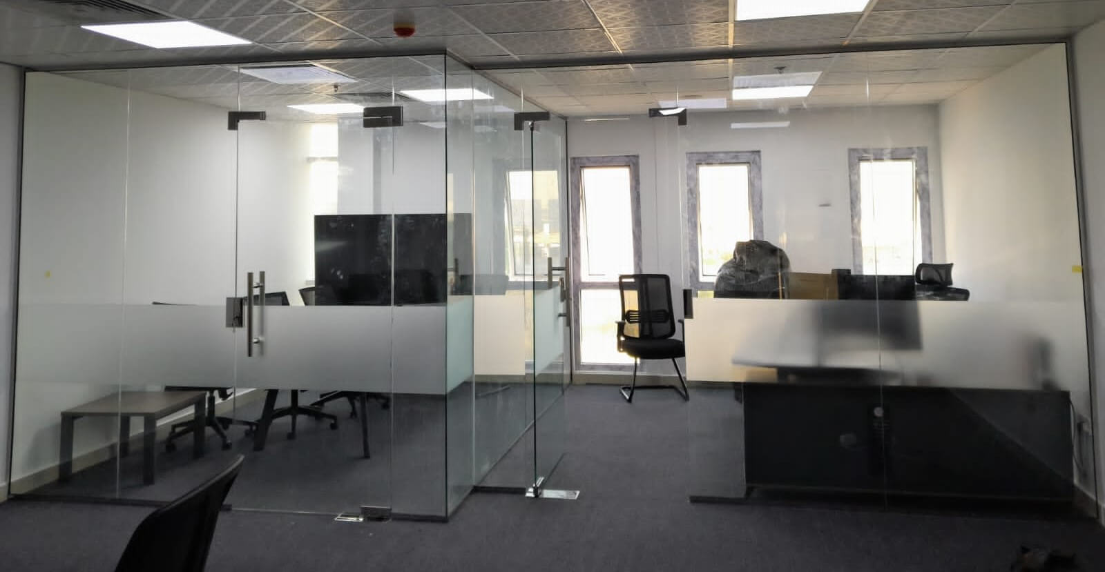 Glass partitions in a modern office by a glass company Dubai
